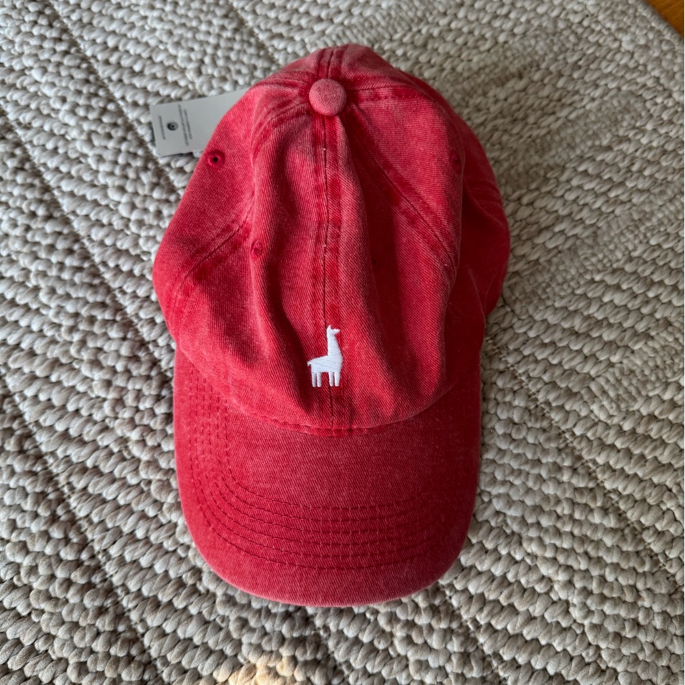 Red cap with alpaca emblem
